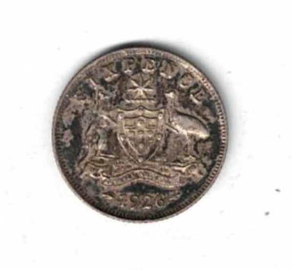 1926 Australia Silver Sixpence Coin . The obverse features the bust of George V facing left. the reverse features the Australia coat of arms.