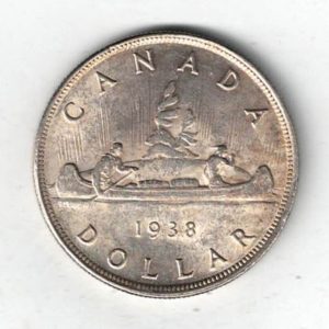 1938 Canada Silver One Dollar Coin. The obverse side of the coin features George VI facing left. The reverse features an aboriginal traveling by canoe.