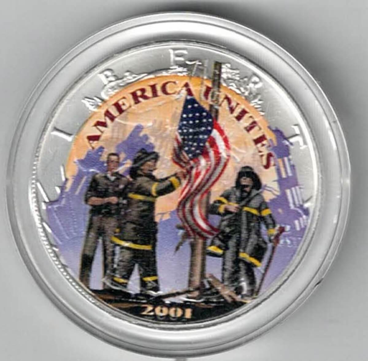2001 Silver USA American Heroes Colourised One Ounce Eagle , The eagle is on the reverse. The coin contains one ounce of 999 fine silver.