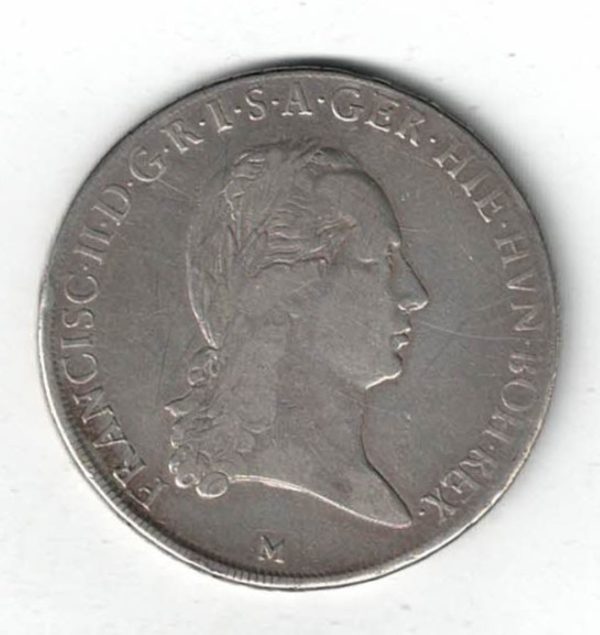1793 M Italy Milan Silver Crocione Coin. The obverse of this coin features the bust of Francisco II. The reverse features a cross with 3 crowns.