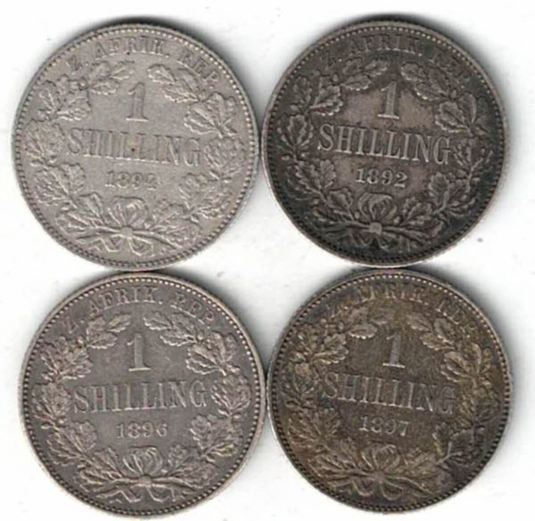 1892/1894/1896 & 1897 South Africa Silver Shilling Coins. The obverse features the bust of president Johannes Paulus Kruger facing left.