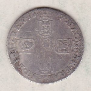 1697 silver sixpence coin featuring King William III on the obverse. The Reverse is completed with crowned cruciform shields around central lion.