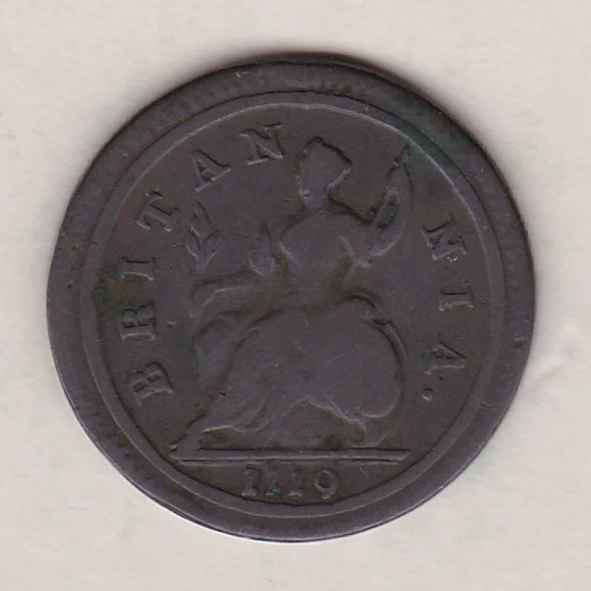 1719 copper halfpenny coin featuring King George I on the Obverse. Britannia seated facing left holding a trident on the Reverse.