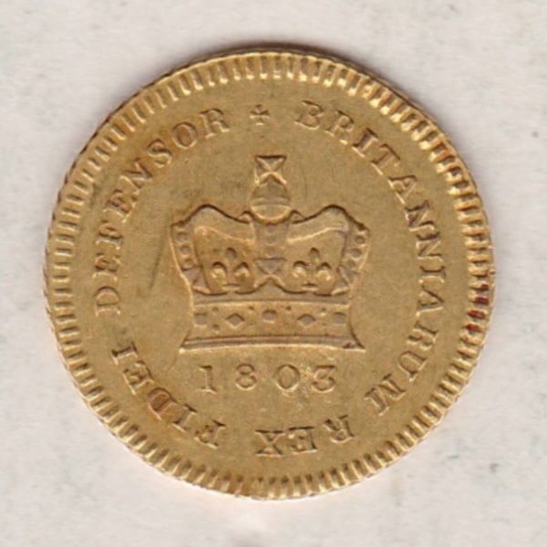 1803 Gold Third Guinea Coin featuring the laureate head portrait of King George III on the obverse. The reverse central crown with legend around and date.