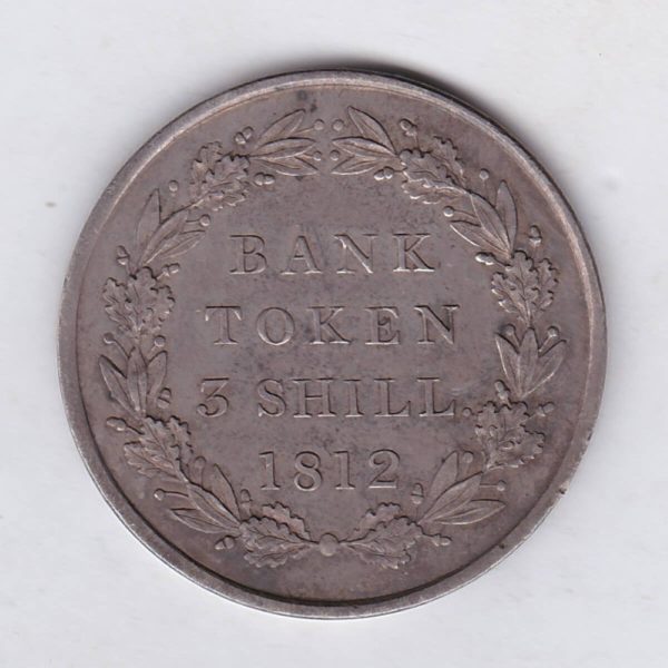 1812 Silver Three Shillings emergency issue bank token. The token features the laureate portrait of King George III on the obverse.