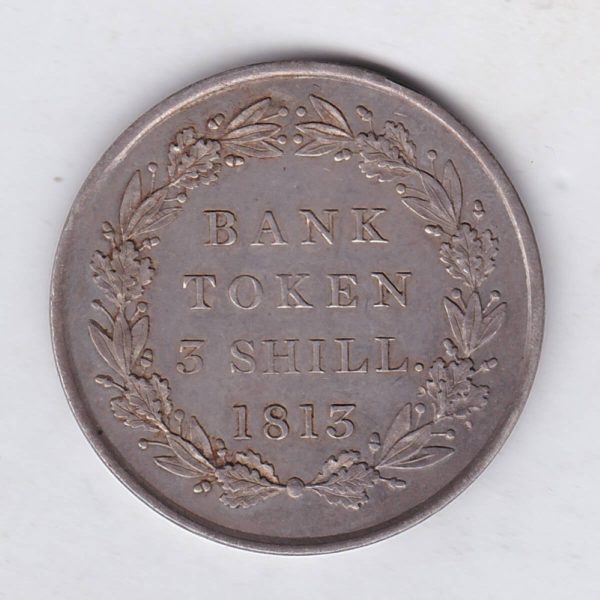 1813 Silver Three Shillings emergency issue bank token. The token features the laureate portrait of King George III on the obverse.