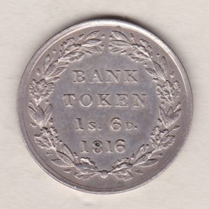 1816 Silver One Shilling And Sixpence emergency issue bank token. The token features the laureate portrait of King George III on the obverse.