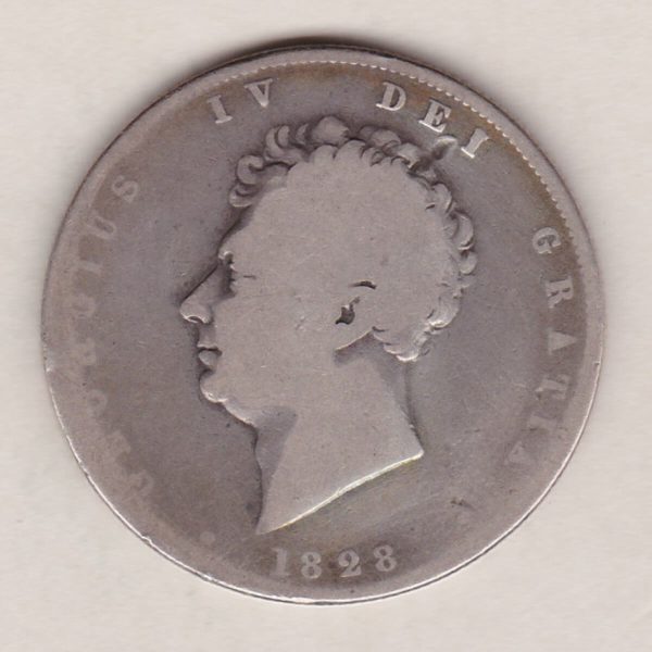 1828 Silver Halfcrown coin with King George IV on the Obverse. A crowned and mantled shield of arms over a banner, with legend around. on the reverse.