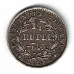 1840 India Silver Quarter Rupee Coin . The obverse side of this coin features the portrait of Queen Victoria facing left.