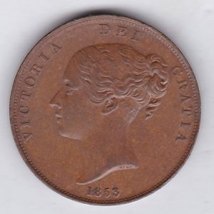 1853 copper penny coin featuring the young head portrait of Queen Victoria on the Obverse. The coin depicts Britannia seated to the right on the Reverse.