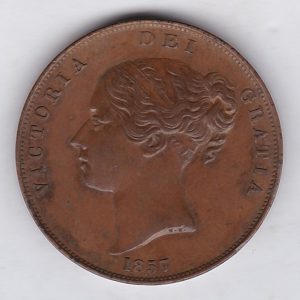1857 copper penny coin featuring the young head portrait of Queen Victoria on the Obverse. The coin depicts Britannia seated to the right on the Reverse.
