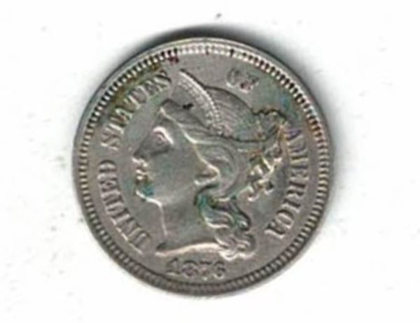 1876 USA Nickel Three Cents Coin. The Obverse features a female portrait facing left. The reverse features roman numerals within a wreath.