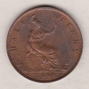 1880 Bronze Halfpenny coin featuring the portrait of Queen Victoria on the obverse. The reverse side of the coin depicts Britannia seated to the right.