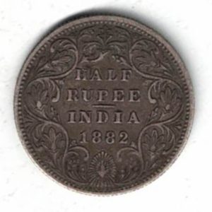 1882 India Silver Half Rupee Coin . The obverse side of this coin features the crowned portrait of Queen Victoria facing left.