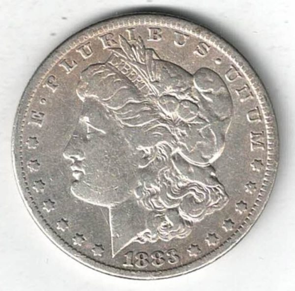 1883 CC Silver USA Morgan Dollar coin featuring lady liberty on the obverse. The eagle holding arrows and an olive branch on the reverse.