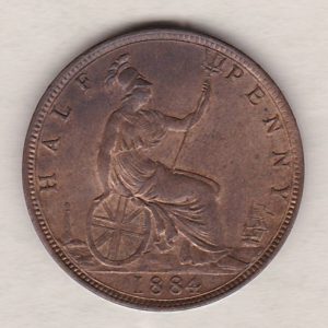 1884 Bronze Halfpenny coin featuring the portrait of Queen Victoria on the obverse. The reverse side of the coin depicts Britannia seated to the right.