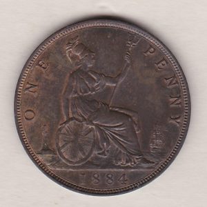1884 bronze penny coin featuring the young head portrait of Queen Victoria on the Obverse. The coin depicts Britannia seated to the right on the Reverse.