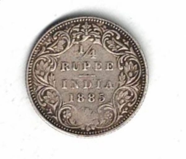 1885 India Silver Quarter Rupee Coin . The obverse side of this coin features the portrait of Queen Victoria facing left.