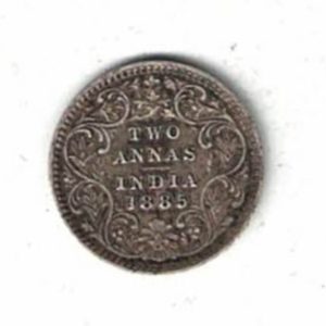 1885 India Silver Two Annas Coin. The obverse side of this coin features the portrait of Queen Victoria facing left. All coins are in stock.
