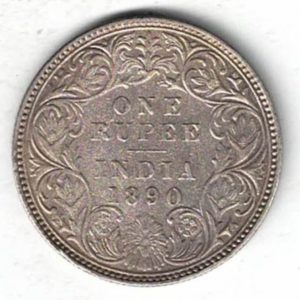 1890 India Silver One Rupee Coin. The obverse side of this coin features the crowned portrait of Queen Victoria facing left.