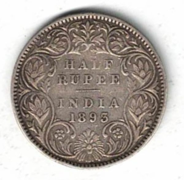 1893 India Silver Half Rupee Coin . The obverse side of this coin features the crowned portrait of Queen Victoria facing left.