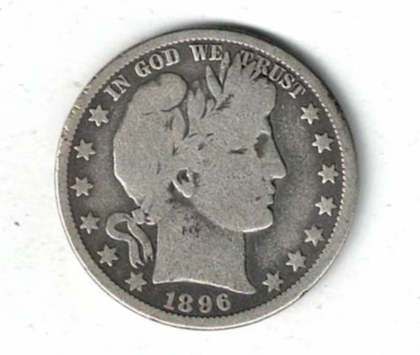 1896 O USA Barber Silver Half Dollar Coin. The reverse features a heraldic eagle with 13 stars above with the denomination below.