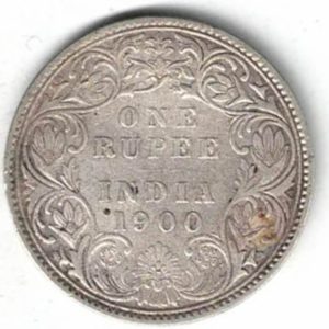 1900 India Silver One Rupee Coin. The obverse side of this coin features the crowned portrait of Queen Victoria facing left.