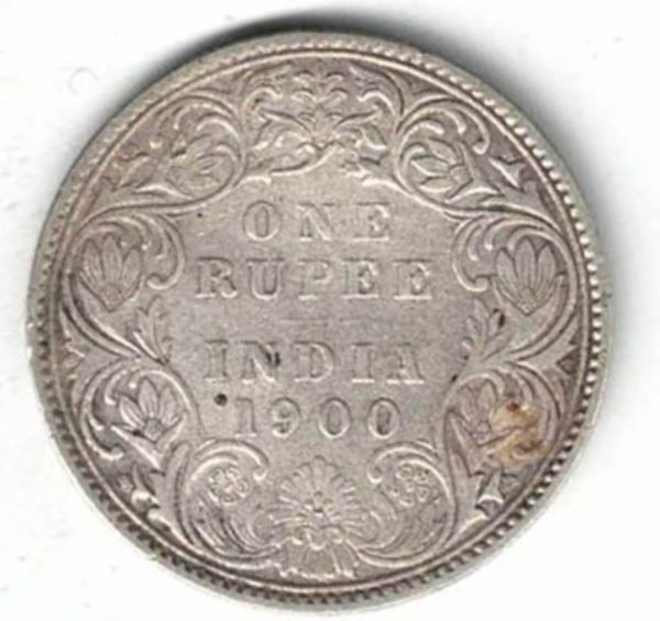 1900 India Silver One Rupee Coin. The obverse side of this coin features the crowned portrait of Queen Victoria facing left.