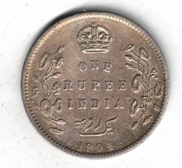 1904 C India Silver One Rupee Coin. The obverse features Edward VII The reverse has the denomination and date with lotus flowers.