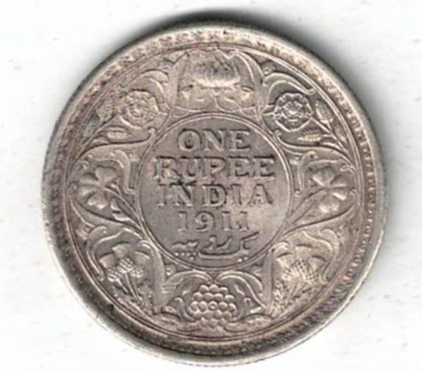 1911 India Silver One Rupee Coin. The obverse features George V. The reverse features The reverse has the denomination and date within circle.