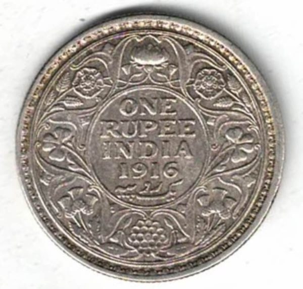 1916 India Silver One Rupee Coin. The obverse features George V. The reverse features The reverse has the denomination and date within circle.