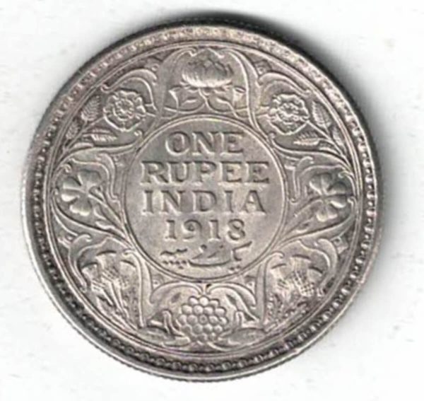 1918 India Silver One Rupee Coin. The obverse features George V. The reverse features The reverse has the denomination and date within circle.