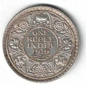 1919 India Silver One Rupee Coin. The obverse features George V. The reverse features The reverse has the denomination and date within circle.