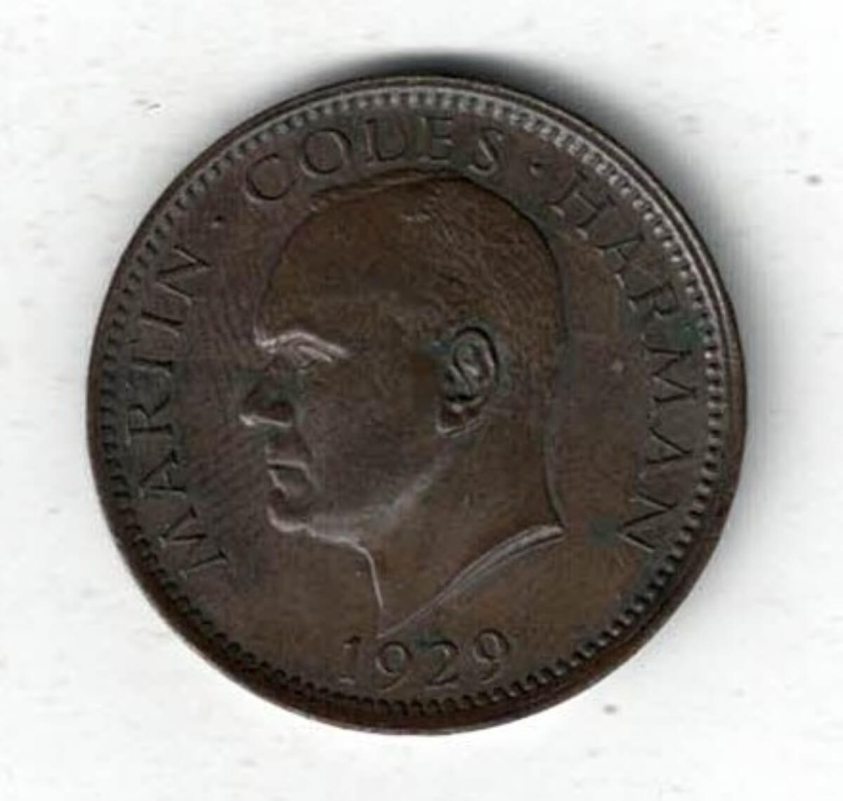 1929 Lundy Bronze Puffin Coin. The obverse features Martin Coles Harman, with the date 1929 below. The reverse side of the coin features a Puffin.