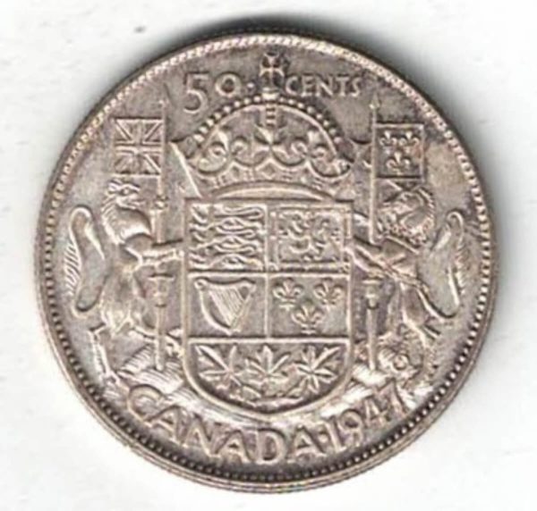 1947 Canada Silver Fifty Cent Coin. The obverse side of the coin features George VI facing left. The reverse features the Royal Coat of Arms of Canada.