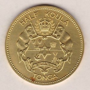1962 Gold Tonga Half Koula Coin. The obverse features a Coat of Arms. The reverse features the standing image of Queen Salote Tudou III.