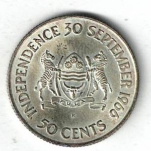 1966 B Botswana Silver Fifty Cents Coin. The obverse features the portrait of sir Seretse Khama. The reverse features the coat of arms of Botswana.