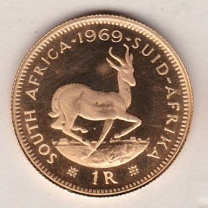 1969 South Africa Gold Proof One Rand coin. The obverse features the portrait of Jan van Riebeeck. The springbok on the Reverse.