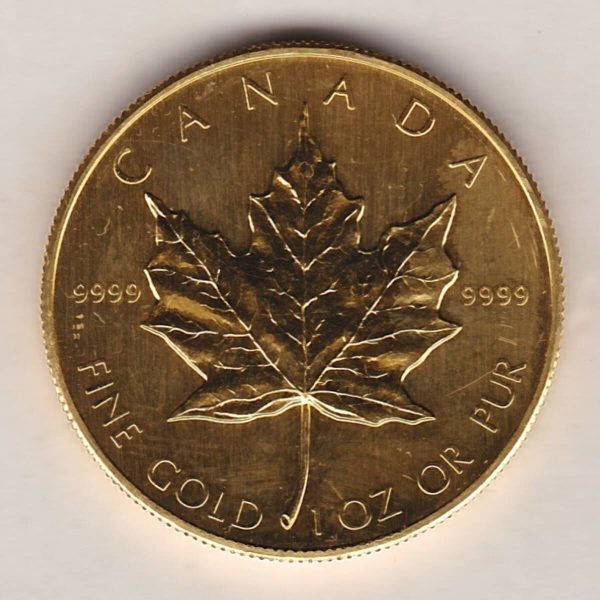 1985 Gold Canada One Ounce coin. Investment one ounce gold coin featuring Queen Elizabeth II on the Obverse. The Maple leaf on the Reverse.