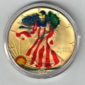 1986 Silver USA Enamelled One Ounce Eagle Coin The liberty is on the obverse, The eagle is on the reverse. The coin contains one ounce of 999 fine silver.
