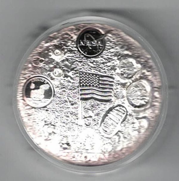 Boxed 2019 Ascension Island Silver Proof First Man On The Moon Coin. The obverse side of the coin features Queen Elizabeth II.