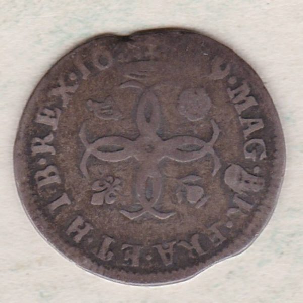 1679 silver maundy fourpence coin featuring King Charles II on the Obverse. The reverse features four interlinked C’s with crown above dividing the date.