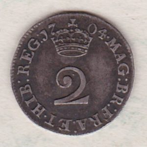 1704 Silver Maundy Twopence coin featuring Queen Anne on the obverse. A central denomination below crown dividing the date on the reverse.