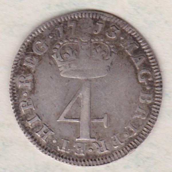 1713 silver maundy fourpence coin featuring Queen Anne on the Obverse. The denomination below a crown dividing date on the Reverse.