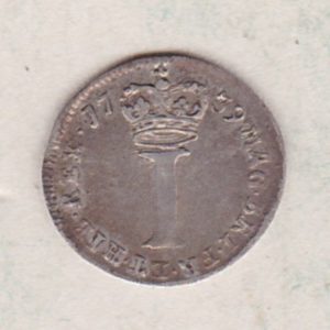 1739 Silver Maundy Penny coin featuring King George II on the obverse. A large central denomination below a crown dividing the date on the reverse.
