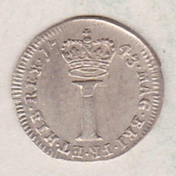 1743 Silver Maundy Penny coin featuring King George II on the obverse. A large central denomination below a crown dividing the date on the reverse.