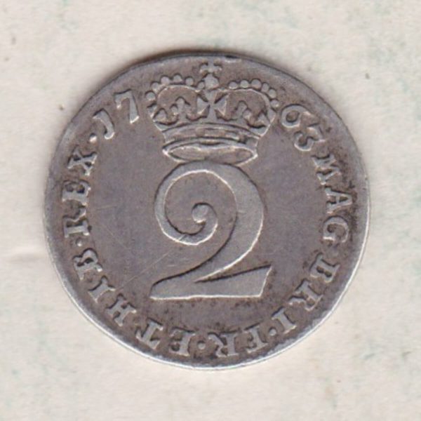1763 Silver Maundy Twopence coin featuring King George III on the obverse. A central denomination below crown dividing the date on the reverse.