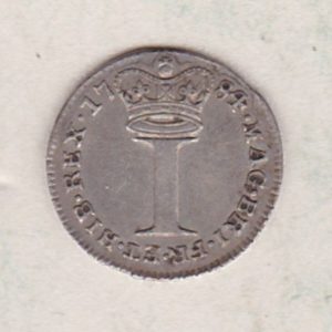 1784 Silver Maundy Penny coin featuring King George III on the obverse. A large central denomination below a crown dividing the date on the reverse.