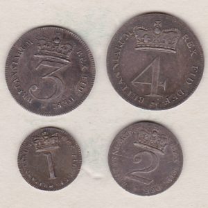 1818 Silver Maundy Set of four coins featuring George III on the Obverse. The Reverse features a central crowned denomination with legend around.