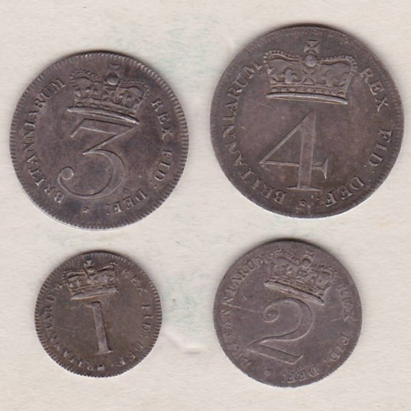 1818 Silver Maundy Set of four coins featuring George III on the Obverse. The Reverse features a central crowned denomination with legend around.